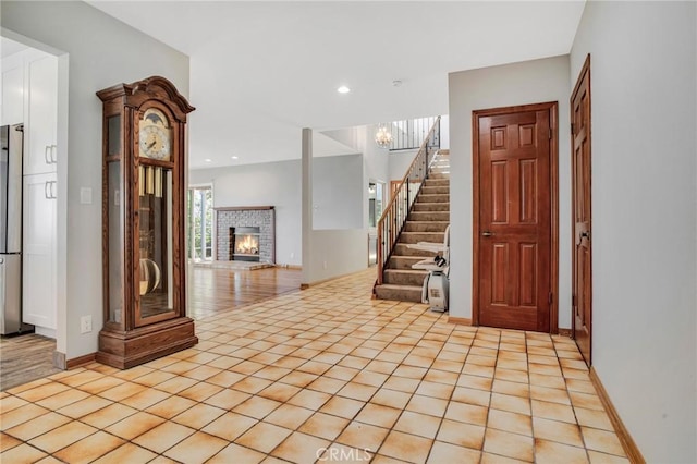 15470 Longbow, Sherman Oaks, CA 91403 - entrance foyer featuring an inviting chandelier, a brick fireplace, stairs, recessed lighting, and baseboards