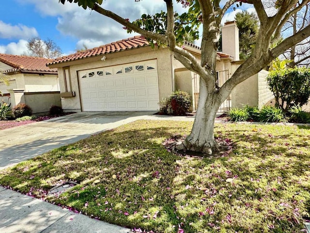 4741 Sequoia Pl, Oceanside, CA 92057 - mediterranean / spanish home with stucco siding, concrete driveway, a tiled roof, and a garage