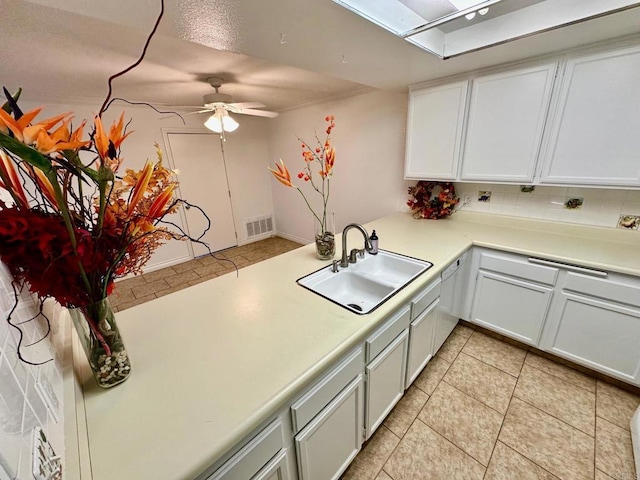 4741 Sequoia Pl, Oceanside, CA 92057 - kitchen with a sink, ceiling fan, light countertops, and decorative backsplash