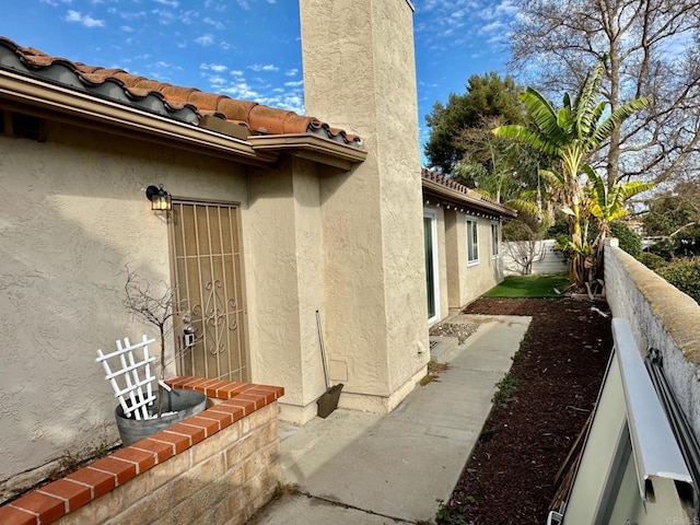 4741 Sequoia Pl, Oceanside, CA 92057 - view of home's exterior featuring stucco siding, fence, and a tile roof