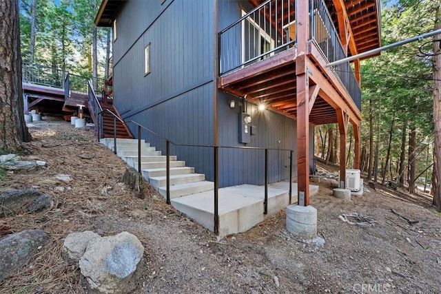 view of side of property with stairway