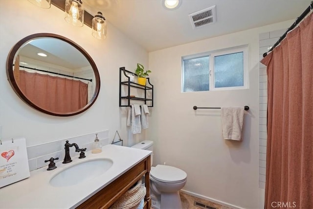 bathroom with toilet, recessed lighting, visible vents, and vanity