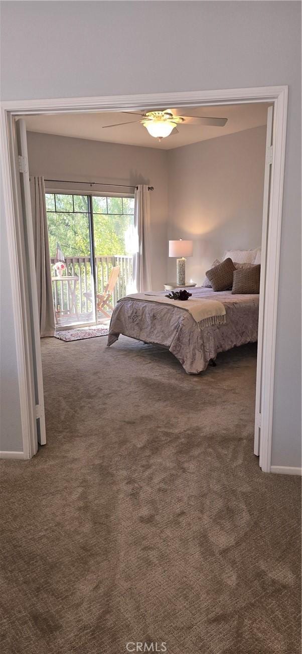 carpeted bedroom featuring a ceiling fan