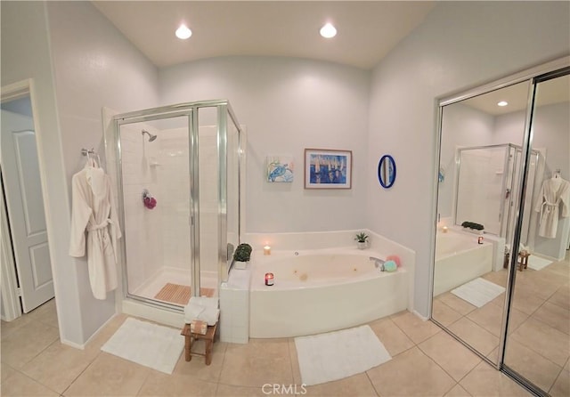 full bath featuring recessed lighting, tile patterned flooring, a bath, and a shower stall