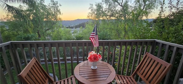 view of balcony at dusk