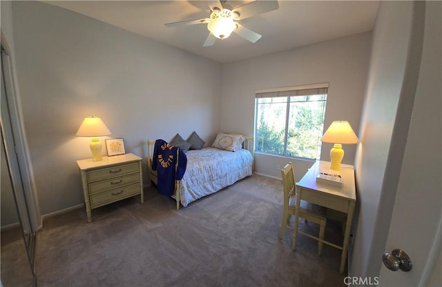 carpeted bedroom with a ceiling fan and baseboards