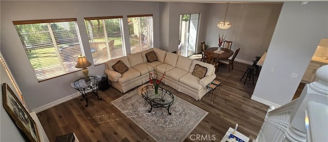 living room with wood finished floors and baseboards