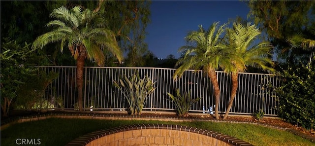 gate at night with fence