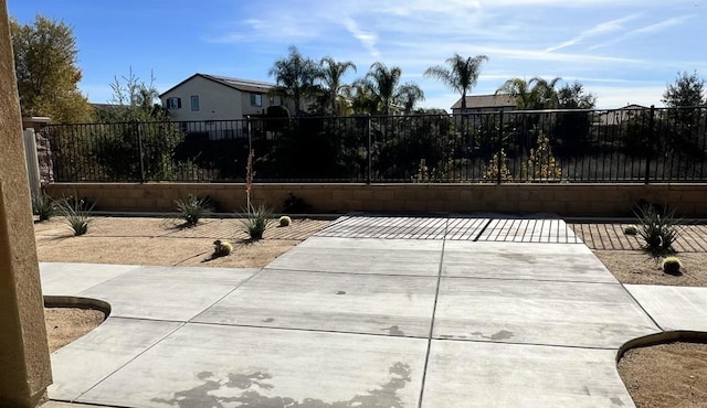 view of patio / terrace featuring fence