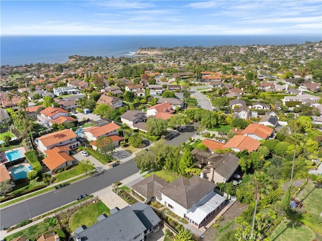 bird's eye view featuring a water view and a residential view