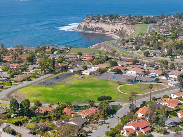 birds eye view of property featuring a water view and a residential view