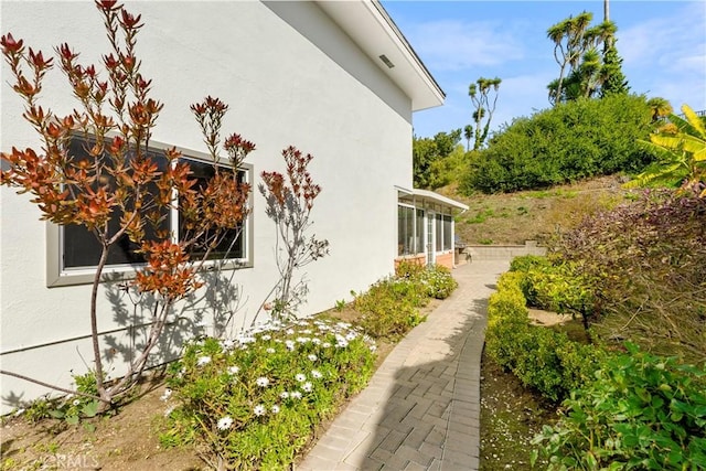 view of property exterior with stucco siding