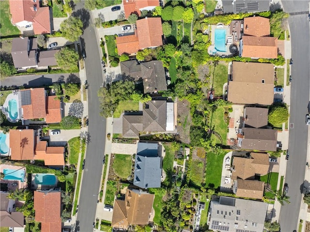 birds eye view of property with a residential view