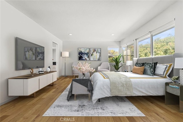 bedroom featuring recessed lighting, baseboards, and light wood finished floors