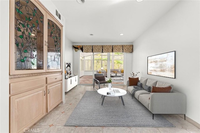 living room with recessed lighting, visible vents, and light tile patterned floors