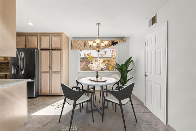 dining room with recessed lighting, visible vents, a notable chandelier, and light tile patterned flooring