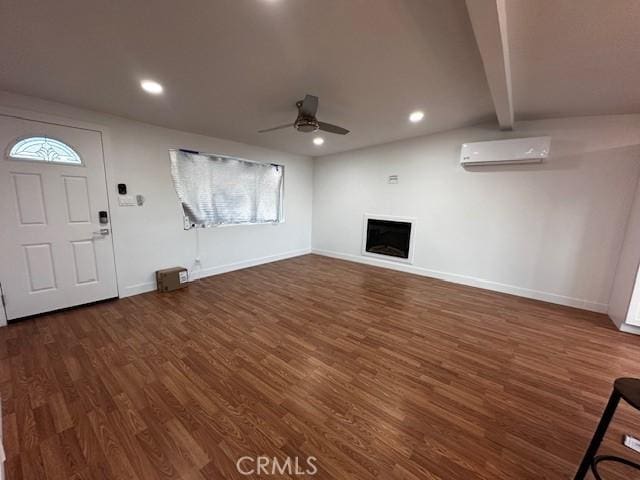 unfurnished living room featuring ceiling fan, a fireplace, wood finished floors, and recessed lighting