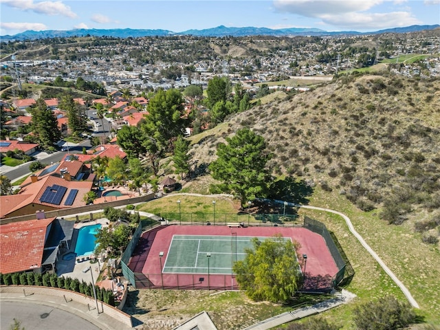 birds eye view of property featuring a mountain view