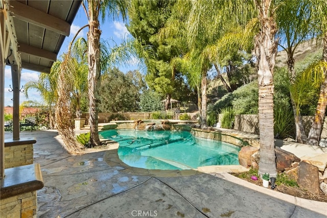 view of pool featuring a fenced in pool, a patio area, and fence