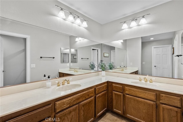 bathroom featuring a sink and double vanity