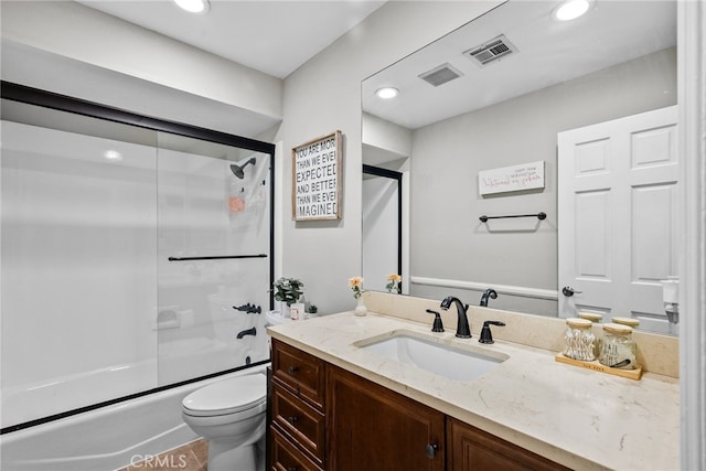 full bathroom with visible vents, toilet, shower / bath combination with glass door, vanity, and recessed lighting