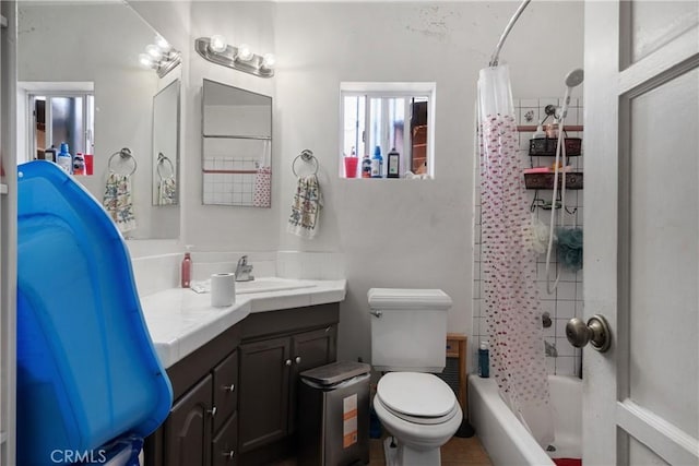 bathroom featuring shower / tub combo, vanity, and toilet