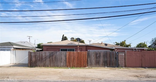 view of home's exterior featuring fence