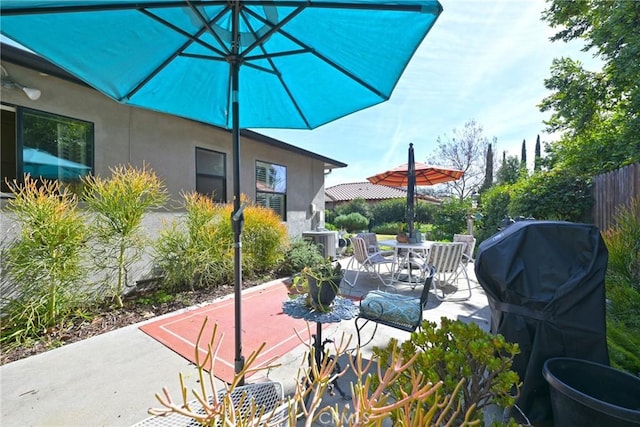 view of patio / terrace featuring outdoor dining space, area for grilling, and fence