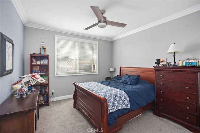 carpeted bedroom with ornamental molding, ceiling fan, and baseboards