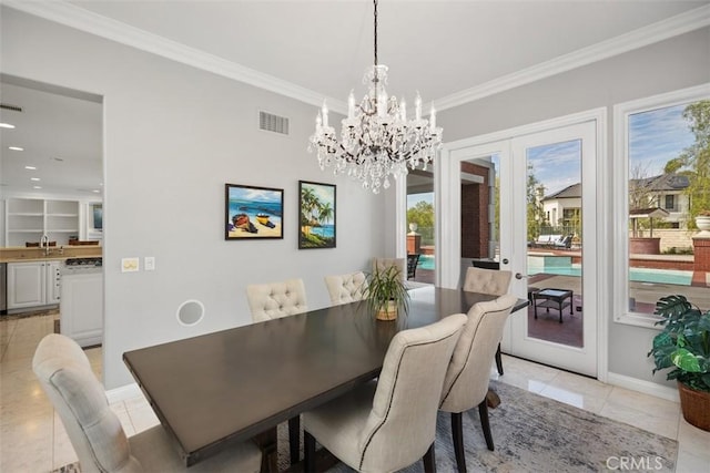 dining room with light tile patterned floors, baseboards, visible vents, and ornamental molding