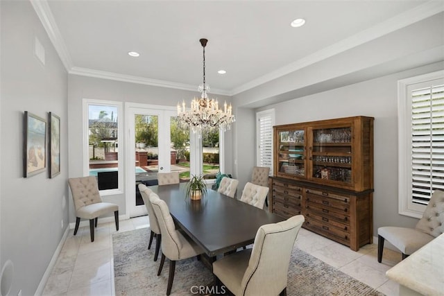 dining area with an inviting chandelier, ornamental molding, and a wealth of natural light