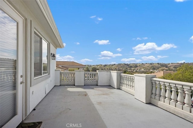 view of patio / terrace with a balcony