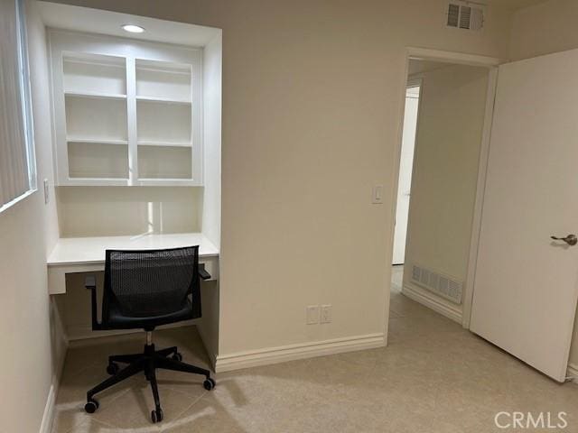 home office featuring visible vents and baseboards