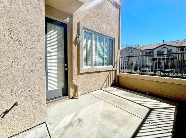 view of patio / terrace featuring a residential view and a balcony