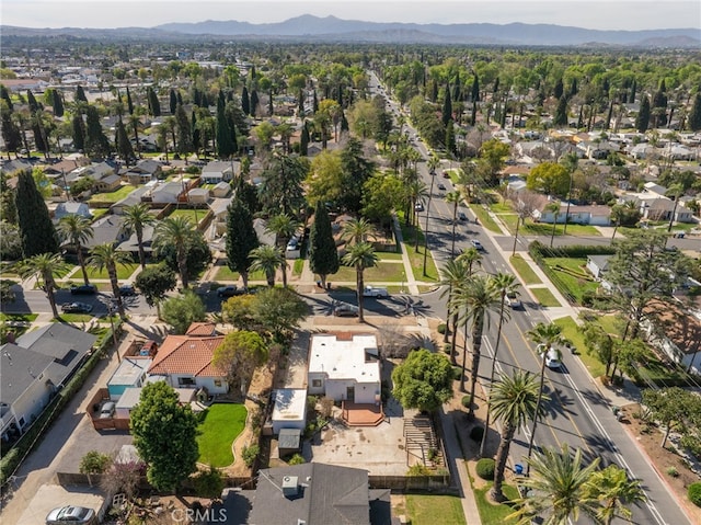 drone / aerial view featuring a residential view and a mountain view