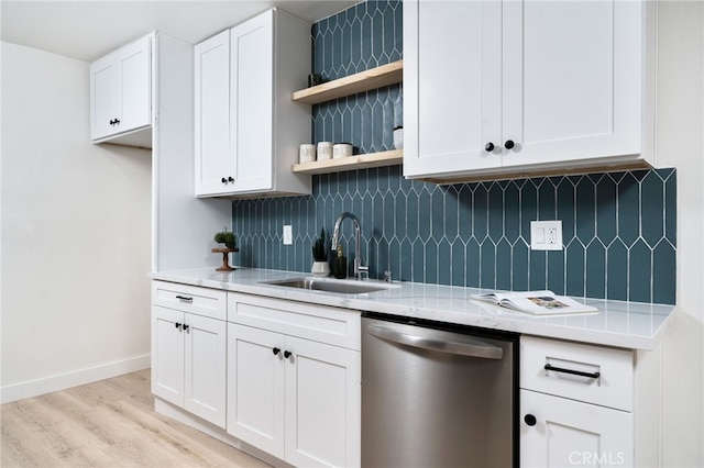 kitchen featuring a sink, tasteful backsplash, open shelves, and stainless steel dishwasher