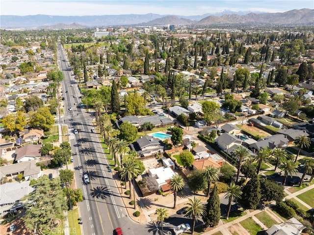 drone / aerial view featuring a residential view and a mountain view