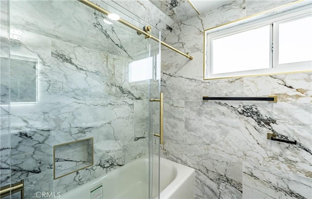 full bathroom featuring bath / shower combo with glass door