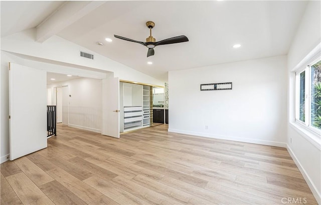 spare room featuring vaulted ceiling with beams, light wood finished floors, visible vents, and recessed lighting