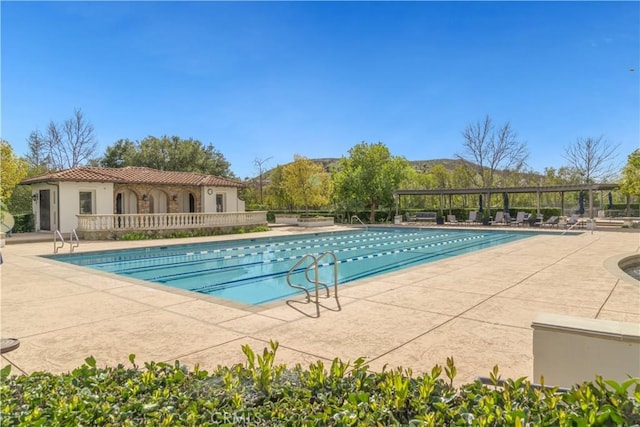 community pool featuring a patio and a pergola