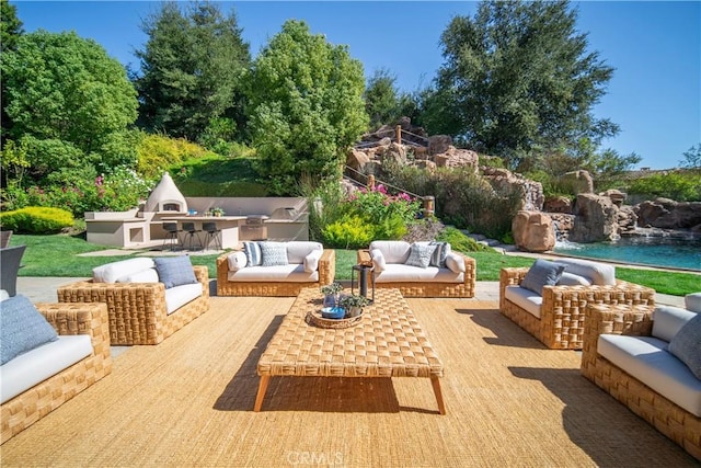 view of patio / terrace featuring outdoor lounge area and an outdoor kitchen