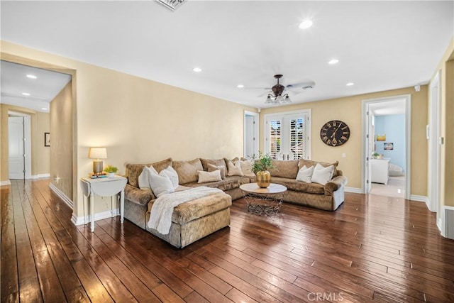 living area with dark wood-type flooring, recessed lighting, french doors, and baseboards