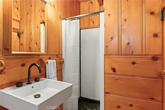 612 Rose Ln, Twin Peaks, CA 92391 - bathroom featuring a sink and wooden walls