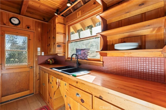 612 Rose Ln, Twin Peaks, CA 92391 - kitchen with wooden counters, light wood-style floors, wooden ceiling, a sink, and wooden walls