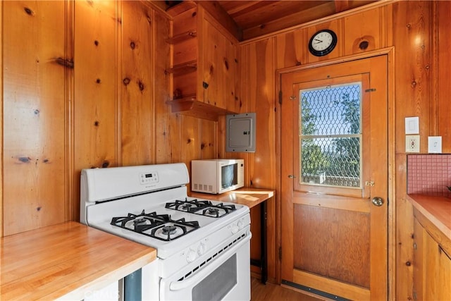 612 Rose Ln, Twin Peaks, CA 92391 - kitchen with white appliances, wooden walls, and electric panel