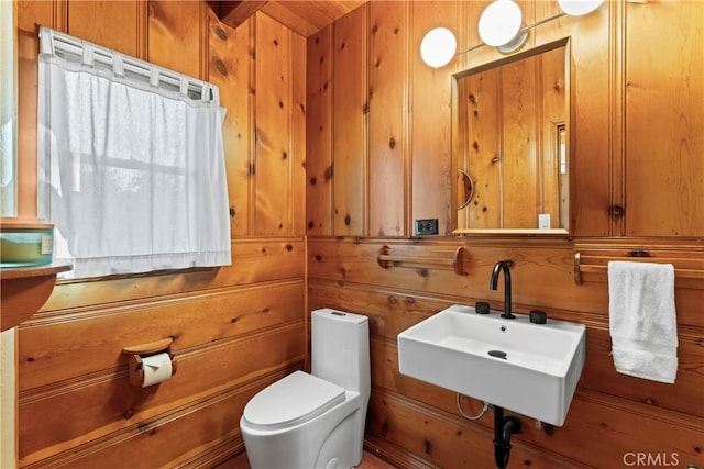 612 Rose Ln, Twin Peaks, CA 92391 - bathroom with a sink, wood walls, and toilet