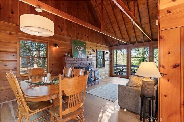 612 Rose Ln, Twin Peaks, CA 92391 - dining space featuring wood ceiling, plenty of natural light, wood walls, beam ceiling, and hardwood / wood-style flooring