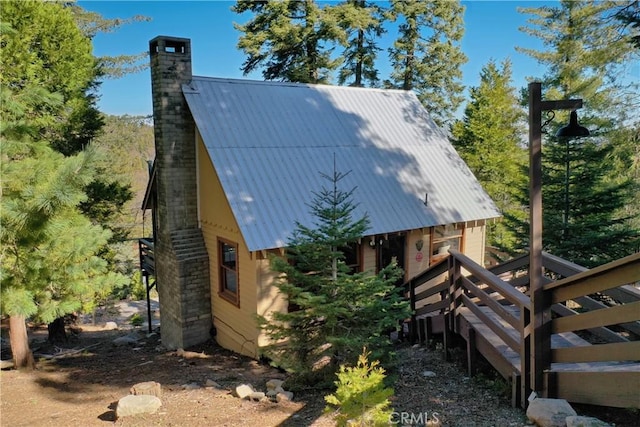 612 Rose Ln, Twin Peaks, CA 92391 - view of property exterior with a chimney and metal roof