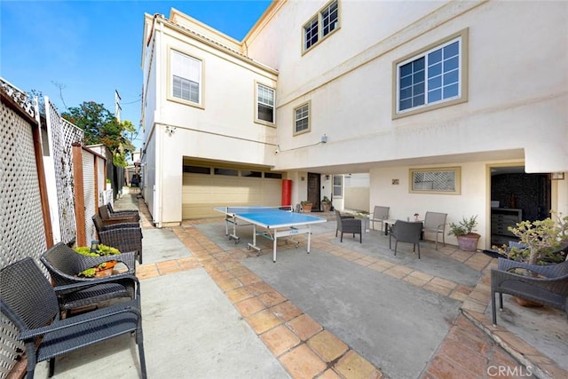 view of patio featuring a garage