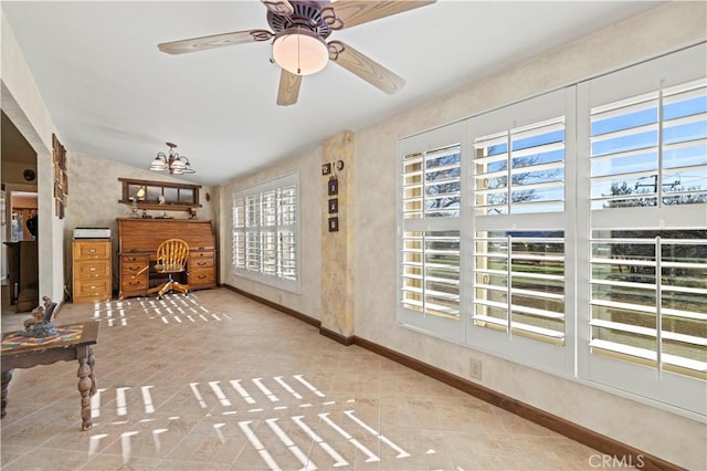 entryway featuring a ceiling fan, tile patterned flooring, vaulted ceiling, and baseboards